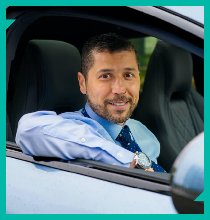 Riccardo sitting in a car