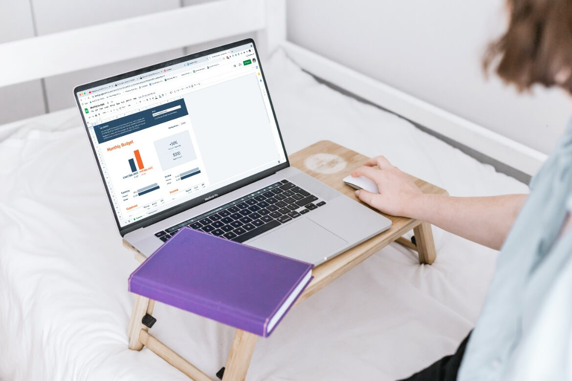 someone budgeting on a laptop